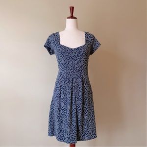 Anthropologie short sleeve blue dress with side pockets and back cut out. Size S